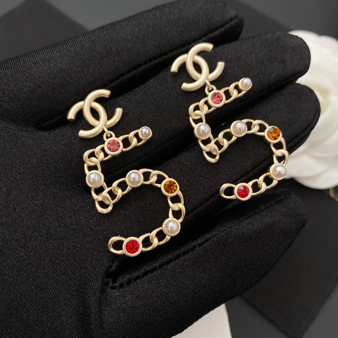 Neue Nr. 5 farbige Diamantohrringe