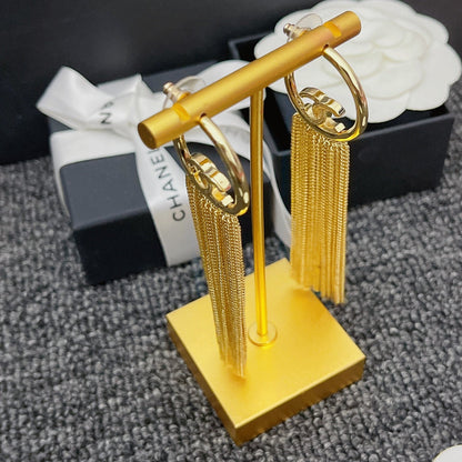Premium Halbkreis-Ohrringe mit Quaste