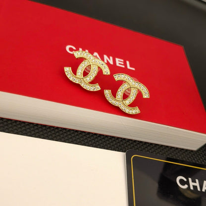 Elegante Logo-Ohrringe aus Silber und Gold