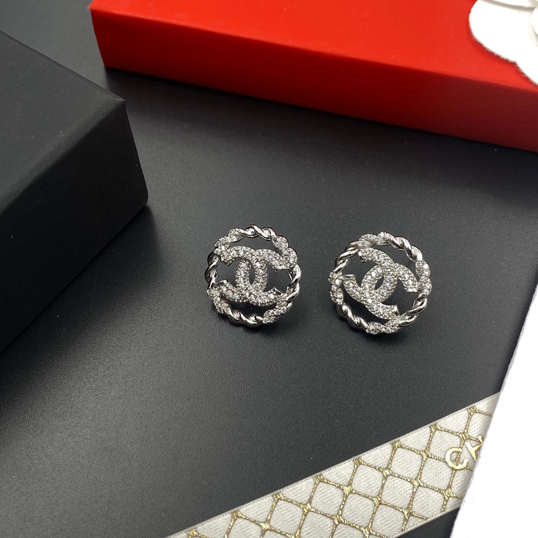 Feine glitzernde Zirkon-Ohrstecker, rund