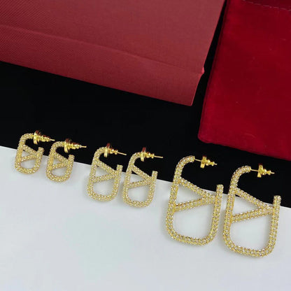 Ohrringe mit Logo und Vollbesatz aus Metall