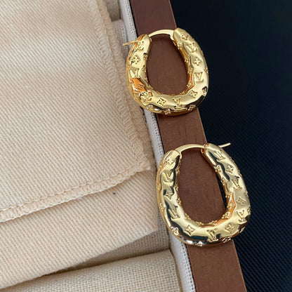 Gold L Blumenstempel Creolen